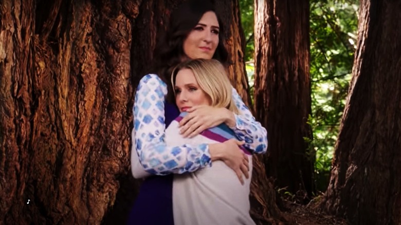 D'Arcy Carden hugging Kristen Bell