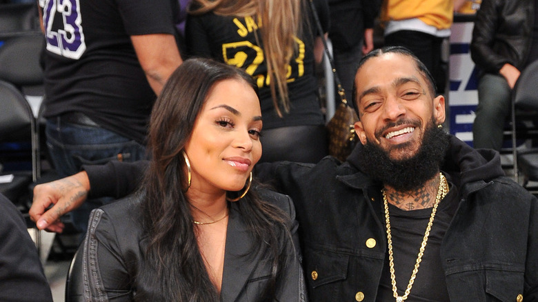 Lauren London and Nipsey Hussle smiling