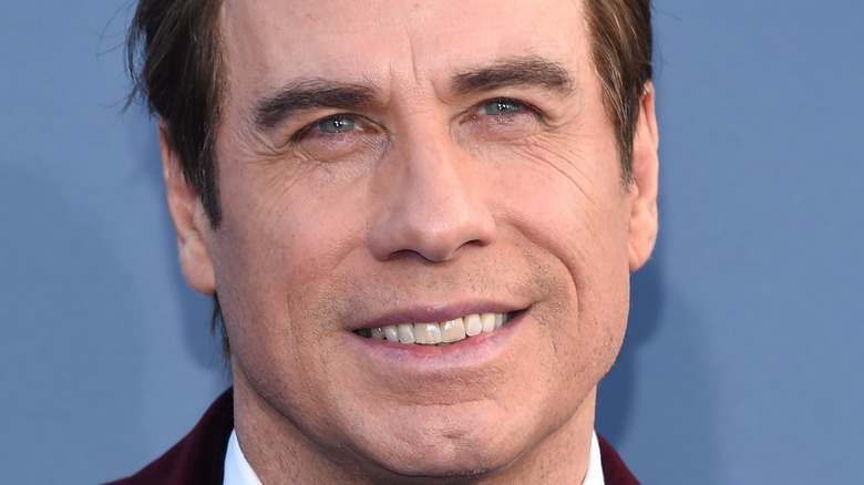 John Travolta smiles on the red carpet