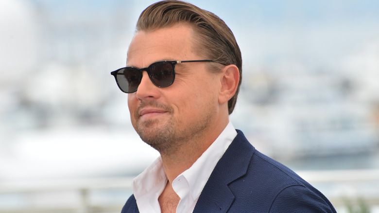 Leonardo DiCaprio poses in aviator glasses and a suit