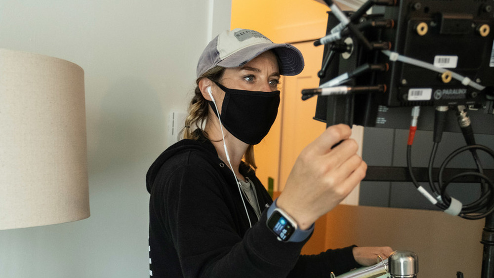 Ashley Williams staring at screen on set