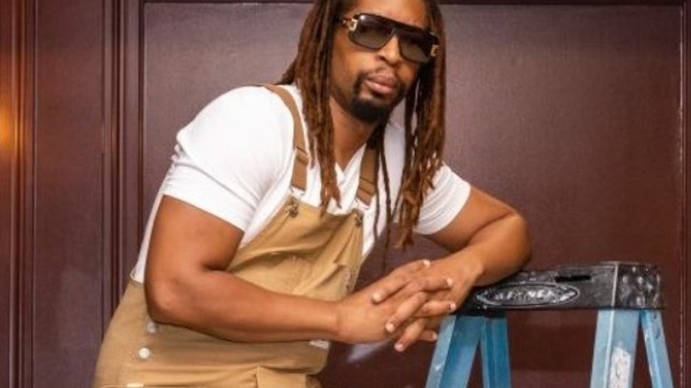 Lil Jon dungarees leaning stepladders