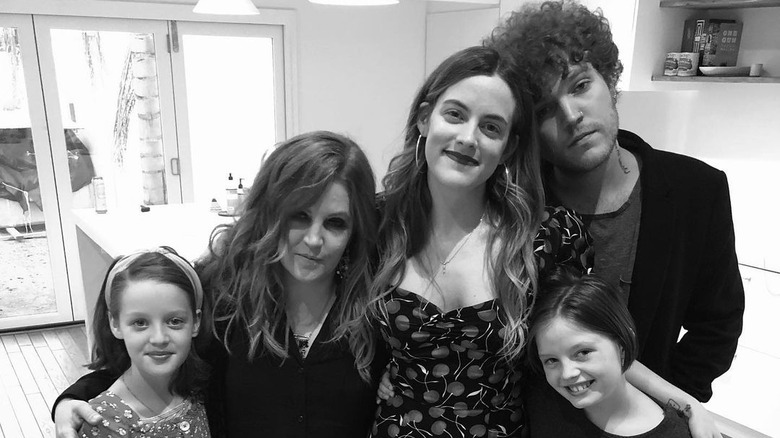 Lisa Marie Presley posing with her children