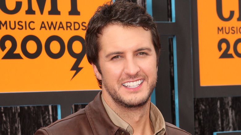 Luke Bryan in brown jacket 