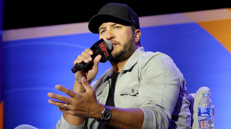 Luke Bryan holding microphone 