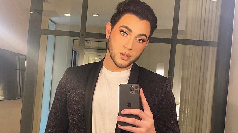 Manny MUA posing