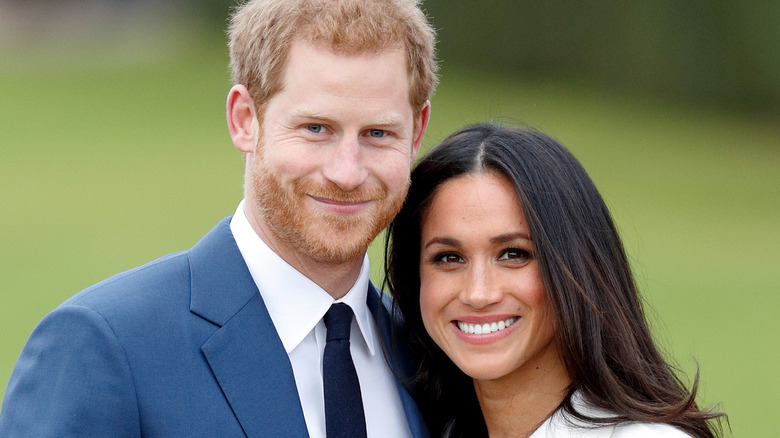 Prince Harry and Meghan Markle smiling