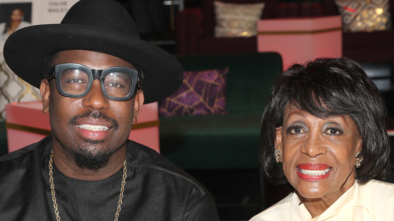 Mikael Moore and Maxine Waters smiling