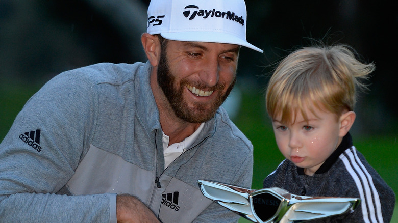 Dustin Johnson and Tatum Gretzky Johnson posing