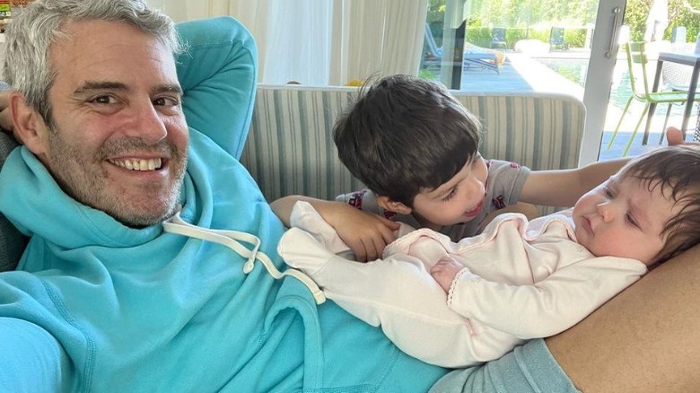 Andy Cohen posing with children Benjamin and Lucy