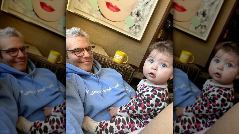 Andy Cohen with daughter Lucy on lap