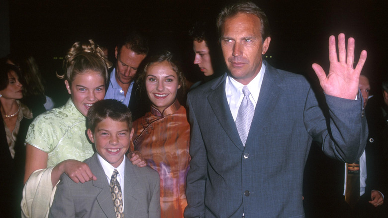 Kevin Costner posing with his children, Annie, Lily, and Joe