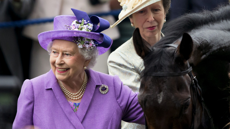 Queen Elizabeth and Princess Anne with a horse