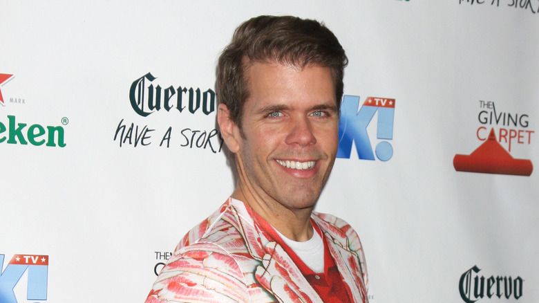 Perez Hilton smiles on red carpet