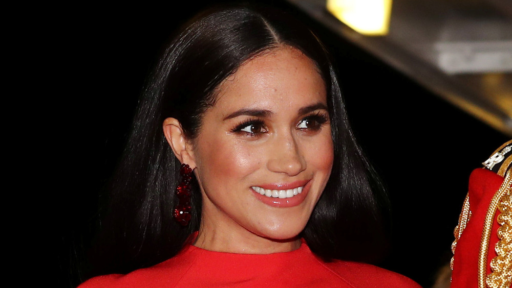 Meghan Markle, the Duchess of Sussex, wearing bright red at an event