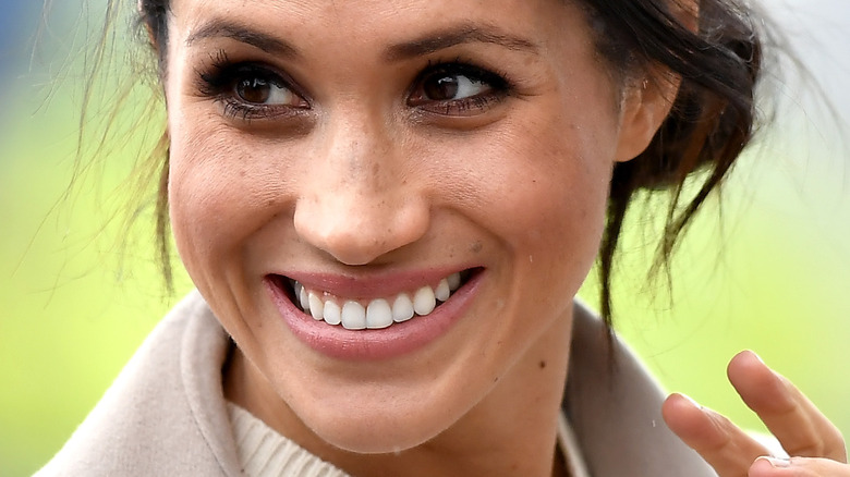 Meghan Markle smiling during an event in Northern Ireland