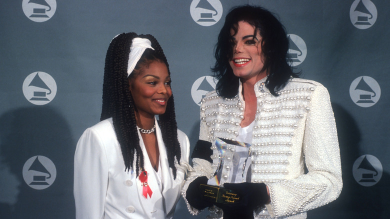 Janet Jackson and Michael Jackson smiling on the Grammys red carpet