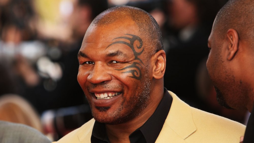 Mike Tyson smiling at camera