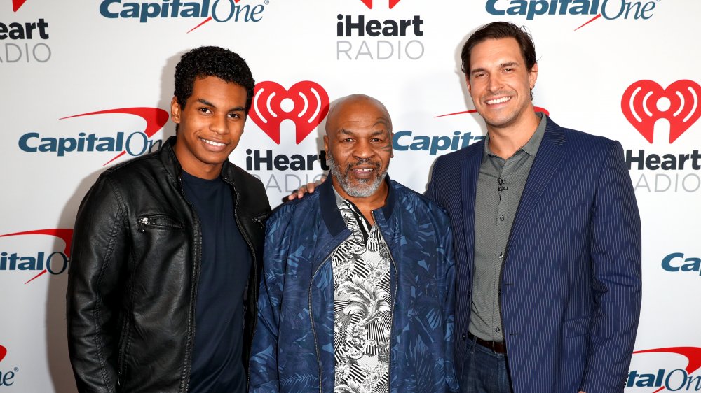 Miguel Leon Tyson, Mike Tyson and Eben Britton posing together at red carpet event