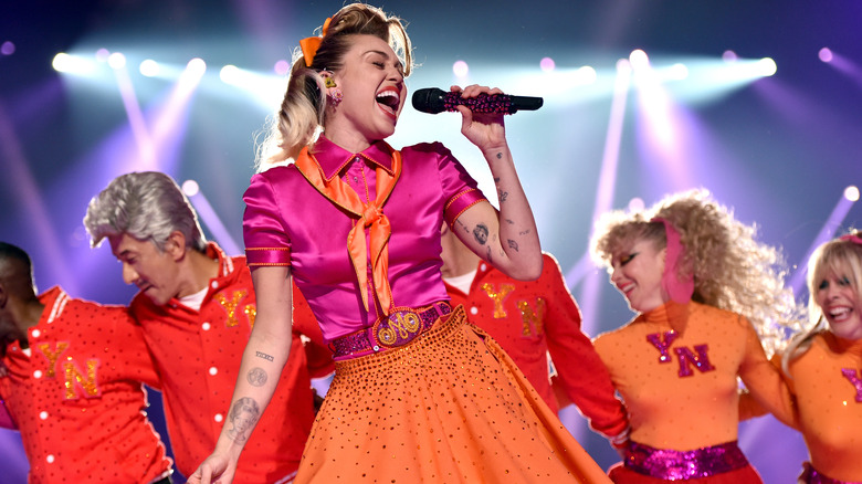 Miley Cyrus performing in '50s style outfit