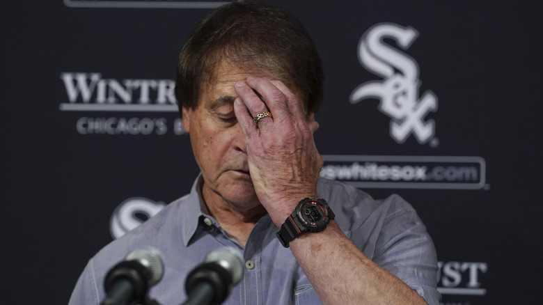 Tony La Russa covers his face 