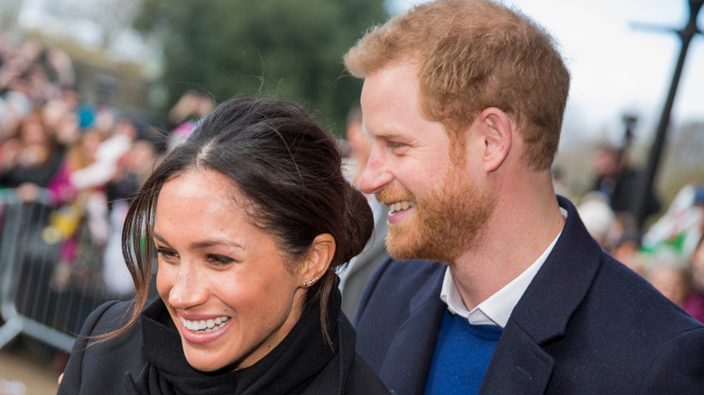 Prince Harry and Meghan Markle smiling