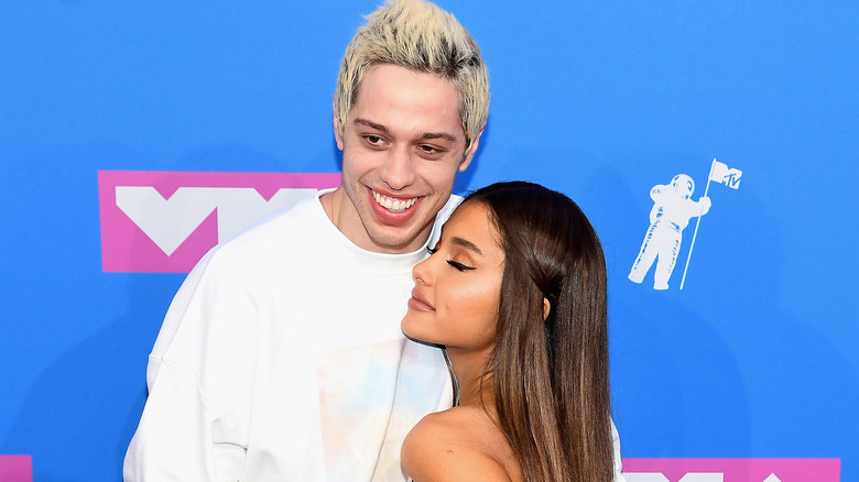 Pete Davidson and Ariana Grande posing