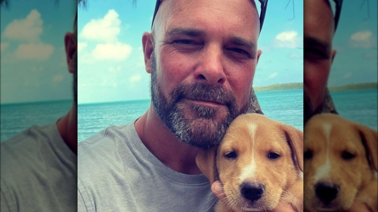 Bryan Baeumler poses with puppy for selfie 