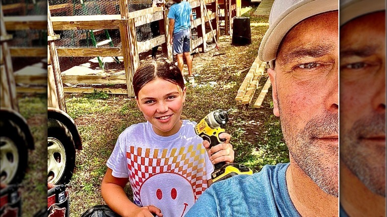 Bryan Baeumler and child pose for selfie 