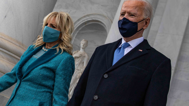 Joe Biden and Jill Biden walking in face masks