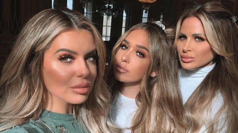 Ariana Biermann, Kim Zolciak, Brielle Biermann pose for a photo