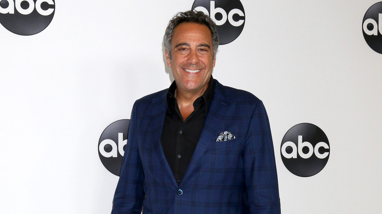 Brad Garrett smiling on the red carpet 