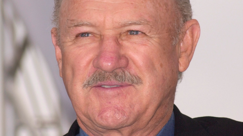 Gene Hackman looks on