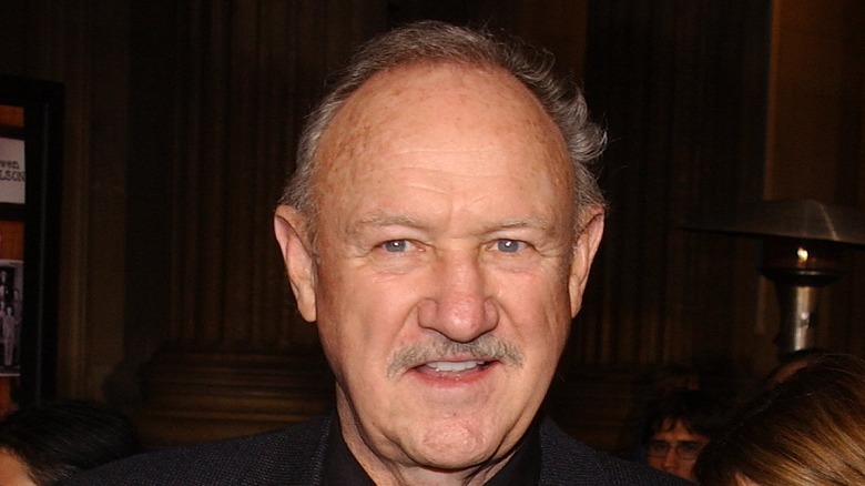 Gene Hackman looks on