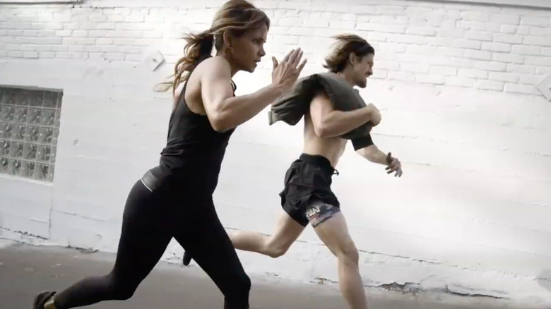 Halle Berry running with man