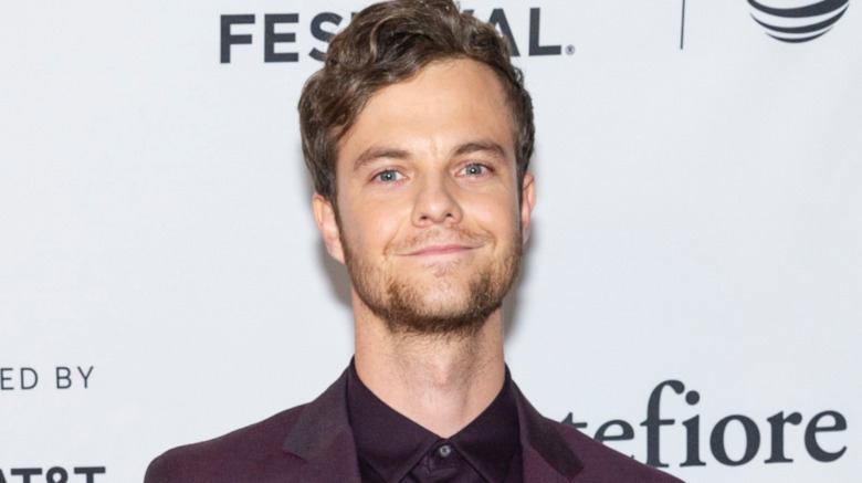 Jack Quaid smiling on red carpet