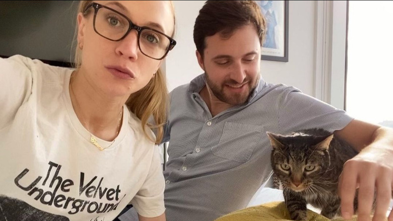 Kat Timpf relaxing with husband and cat