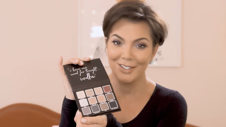 Kris Jenner posing with her makeup