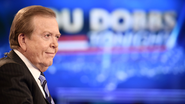 Lou Dobbs, smirking