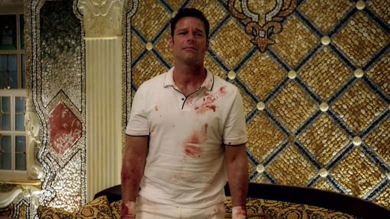 Ricky Martin looking pained in blood-stained shirt