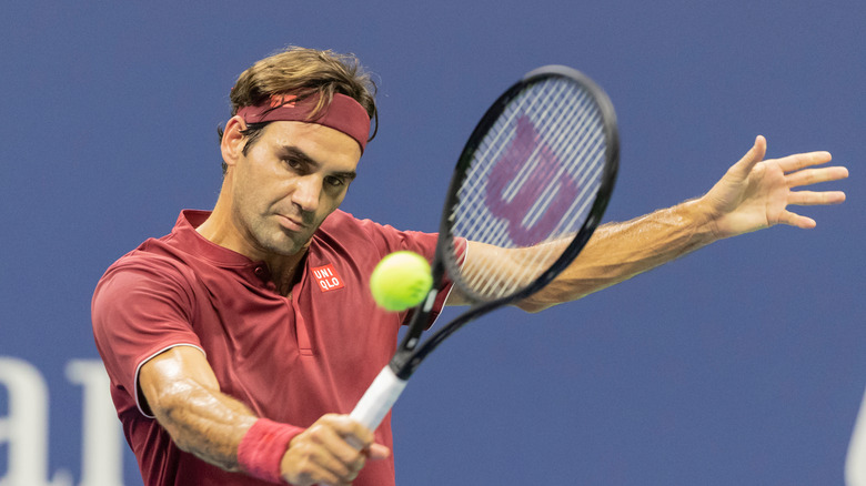 Roger Federer playing tennis 