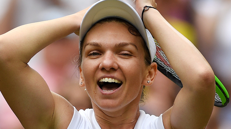 Simona Halep celebrates tennis win with wide grin