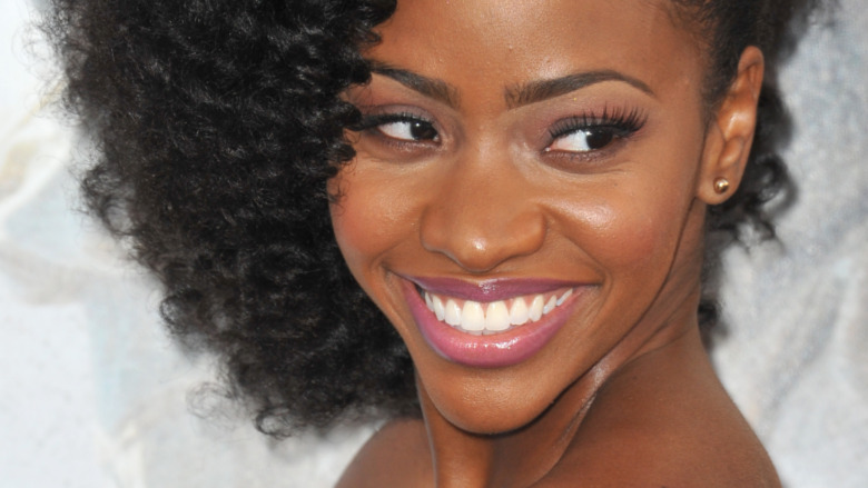 Teyonah Parris smiling on red carpet 