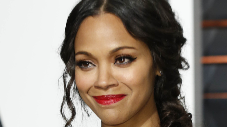 Zoe Saldana smiles on the red carpet