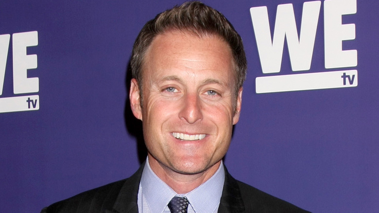 Chris Harrison smiling on the red carpet