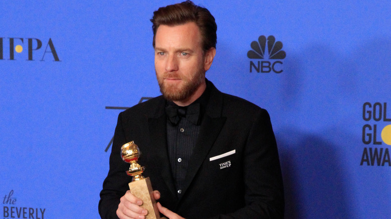 Ewan McGregor poses with his Golden Globe