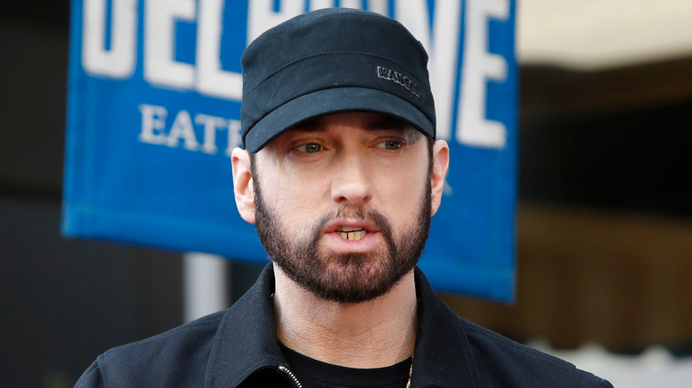 Eminem wearing a hat