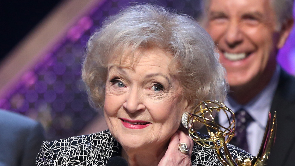 Betty White smiling with eyebrows raised