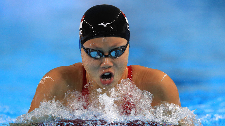 Christie Chue in swimming cap and goggles