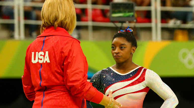 Simone Biles facing her coach